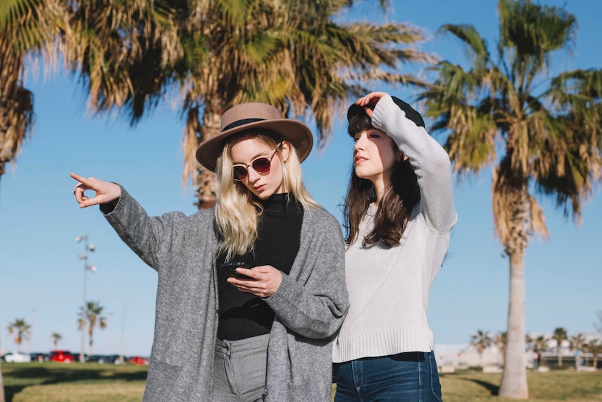 Two women and a mobile phone