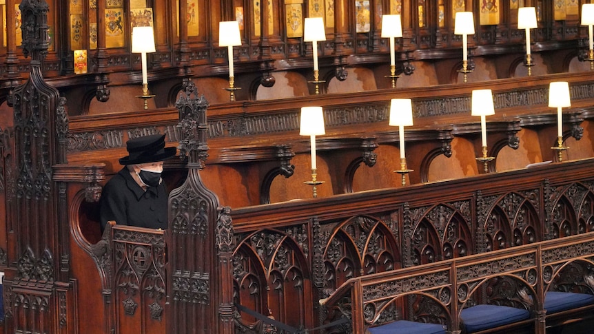 The Queen sits alone at Prince Philip's funeral.