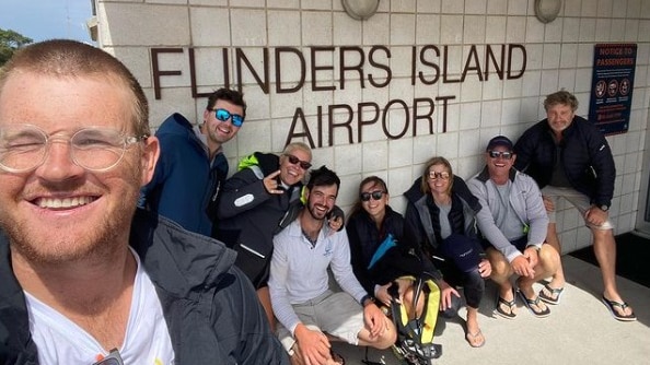 Facebook post showing group of people at Flinders Island airport.