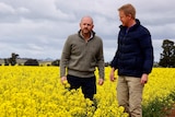 NSW primary industries minister Niall Blair with agronomist Colin McMaster inspecting a canola crop.