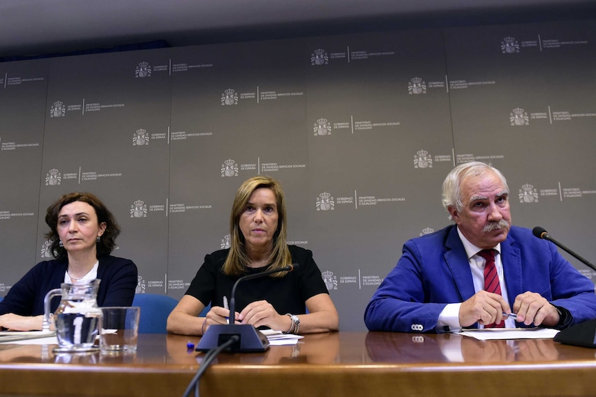 Spanish health officials media conference.jpg