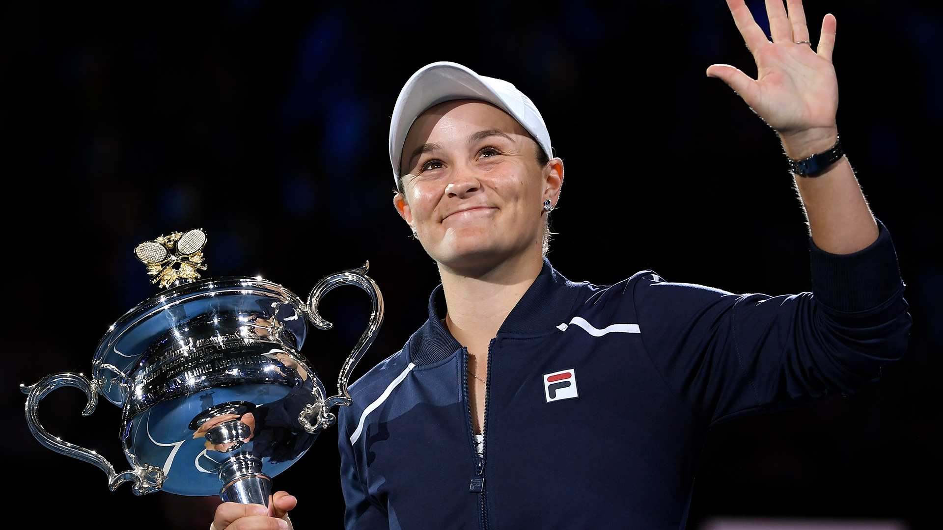 Ash Barty of Australia waves as she holds the Daphne Akhurst Memorial Cup in Melbourne.