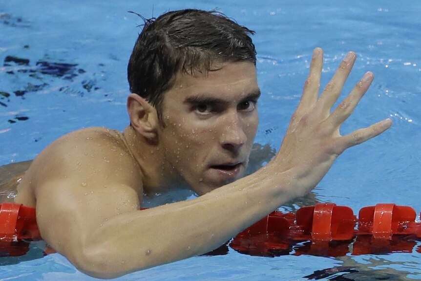 Michael Phelps celebrates winning gold in the men's 200-metre individual medley.