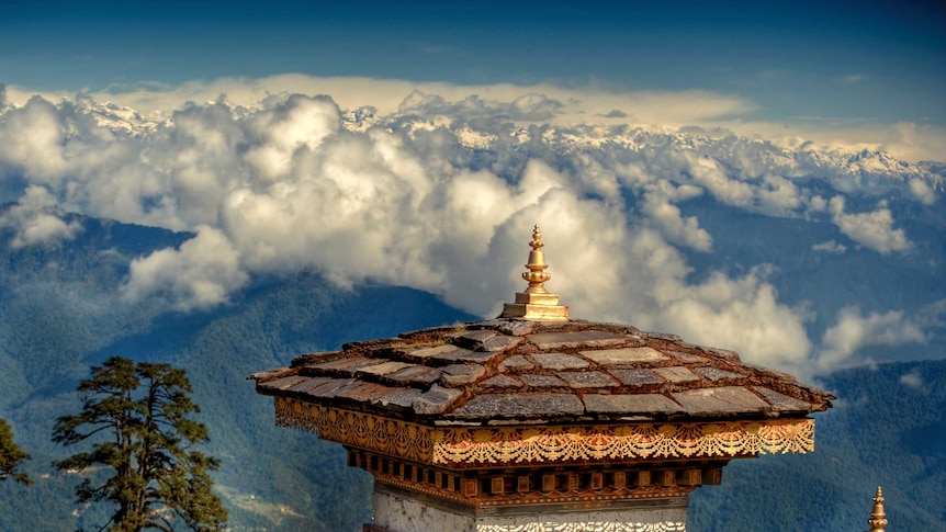 A temple roof-top high above the clouds in Bhutan.