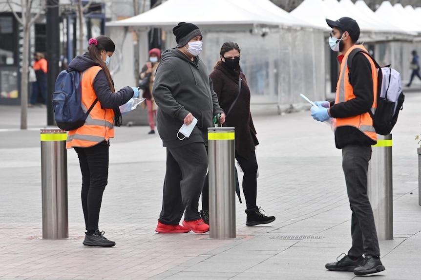 hi-vis vest people hand face mask