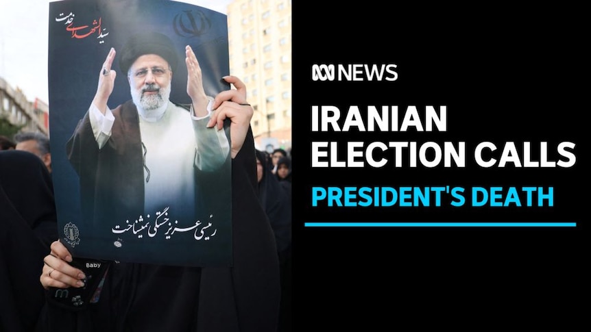 Iranian Election Calls, President's Death: Somene holds up a poster of the late Iranian president Ebrahim Raisi.