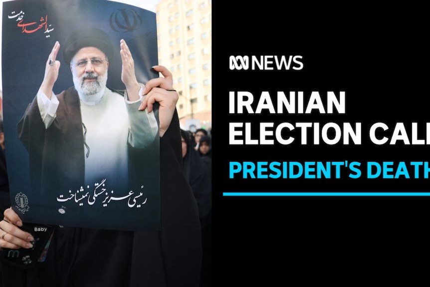 Iranian Election Calls, President's Death: Somene holds up a poster of the late Iranian president Ebrahim Raisi.