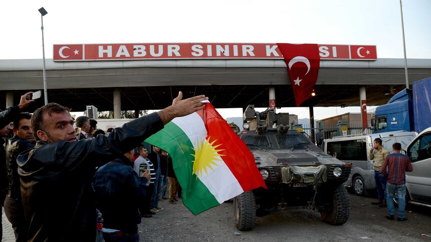 Kurds in Turkey celebrate as Peshmerga fighters cross the border