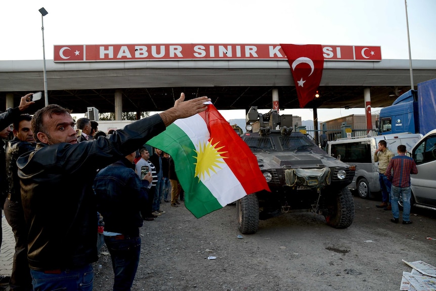 Kurds in Turkey celebrate as Peshmerga fighters cross the border