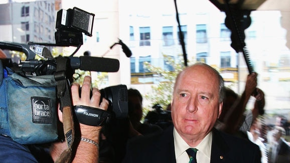 Alan Jones arrives at the Downing Centre court for sentencing after he named a child witness.