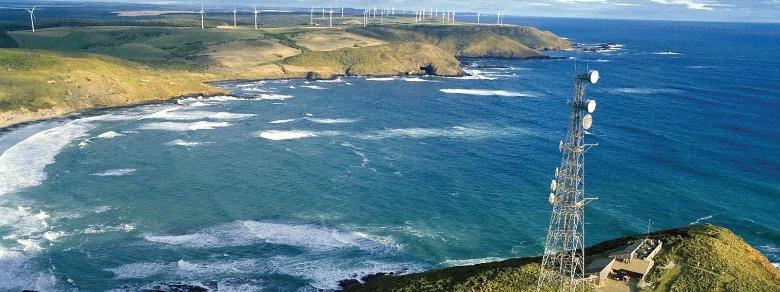 Aerial view of an air monitoring station on a coastal outcrop.