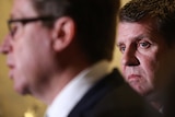 Mike Baird behind Troy Grant during greyhound ban press conference
