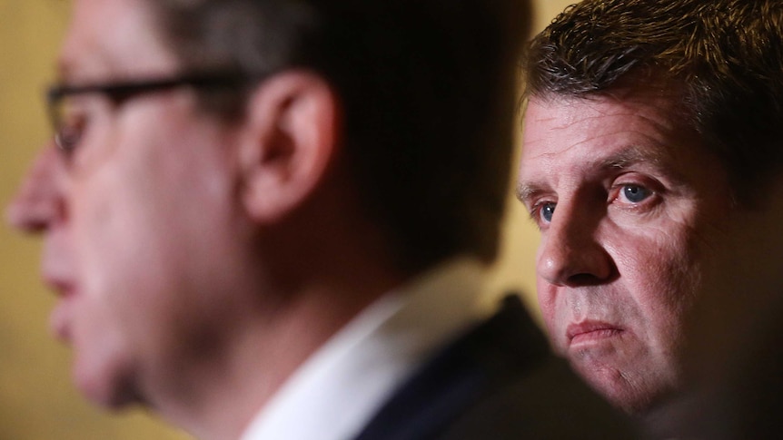 Mike Baird behind Troy Grant during greyhound ban press conference