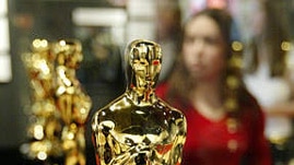 The day before: Students from Inner-City Filmakers (ICF) parade the Oscar statuettes for the 80th Academy Awards down the red carpet and into the Kodak Theater