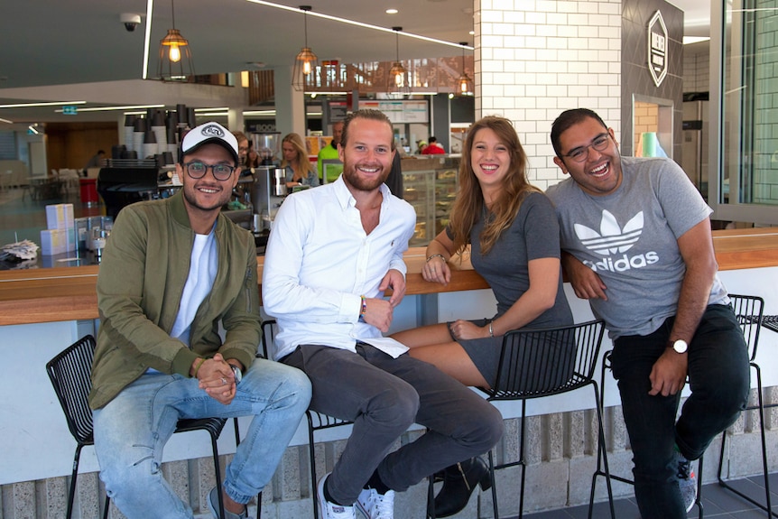 A group of masters students at a cafe in Brisbane.