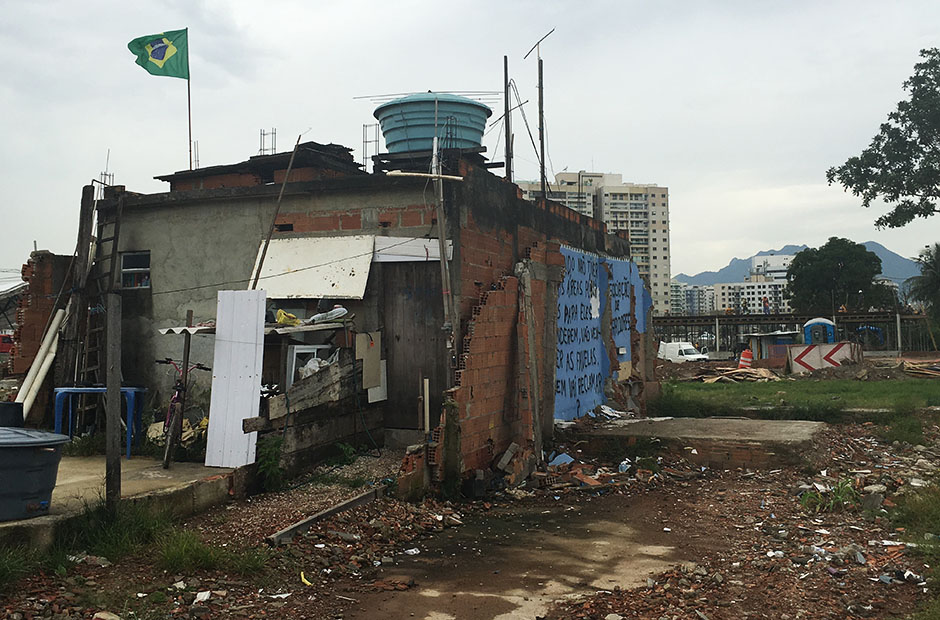 Graffiti and rubbish surrounds a half demolished building at Vila Autodromo.