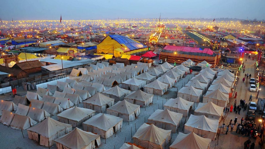 Lights twinkle in a tent city for pilgrims