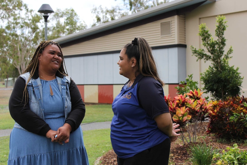 Masada's sister Sa Iosefa and his colleague Letitia Smith smile and laugh together