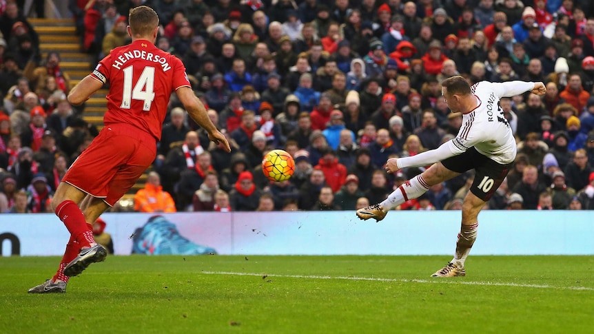 Manchester United's Wayne Rooney volleys a goal against Liverpool at Anfield in the Premier League.