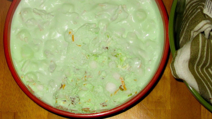 A lurid green salad of marshmallows and cheese.