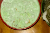 A lurid green salad of marshmallows and cheese.
