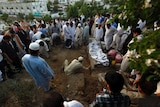 Men prepare the grave of Zara Shahid Hussain