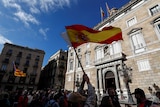 Spanish and Catalan separatist flags are waved in Barcelona.