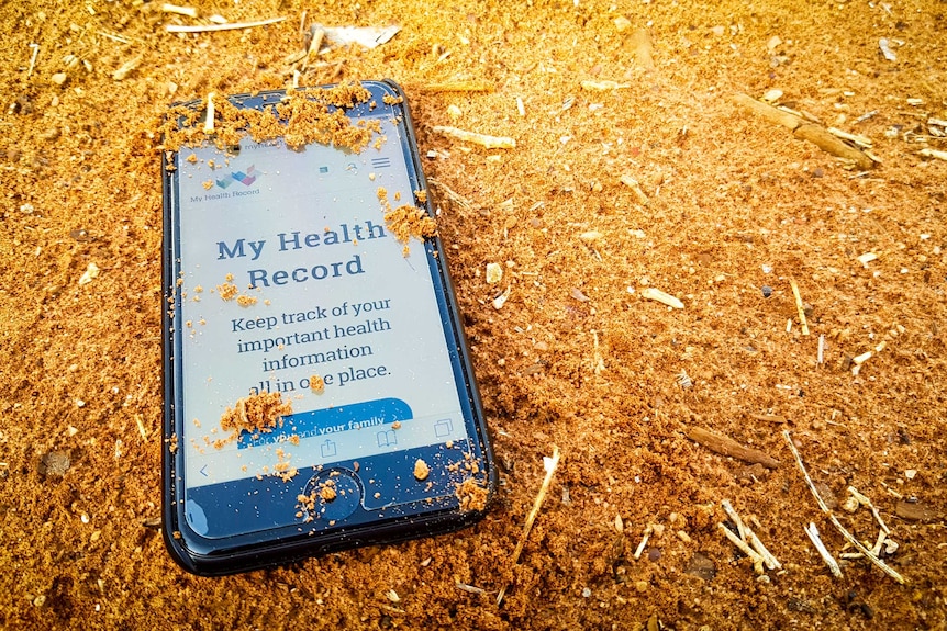 My Health Record website on phone in red dirt