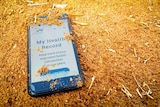 My Health Record website on phone in red dirt