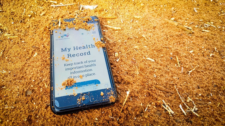 My Health Record website on phone in red dirt