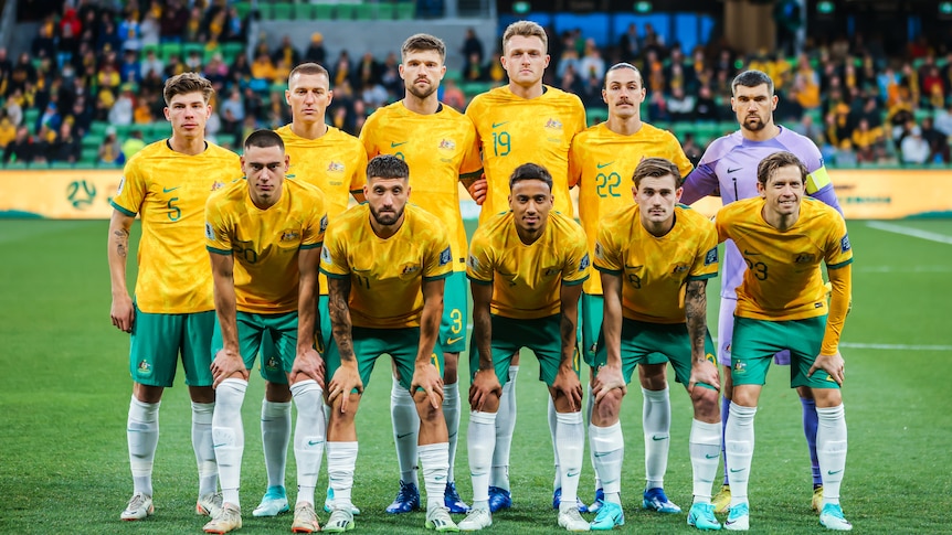 The Socceroos starting XI poses for a photo before a match