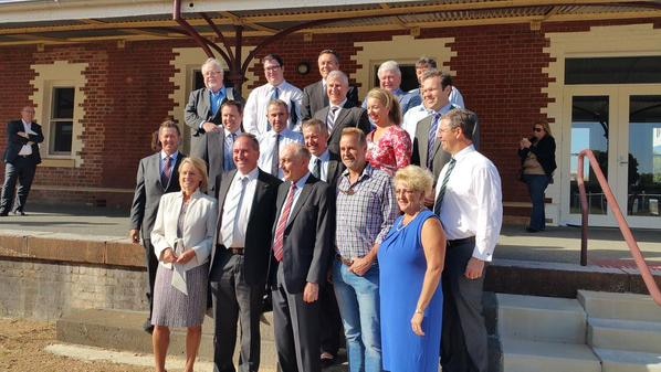National Party federal MPs stand posing for a group photo at Wodonda train station.