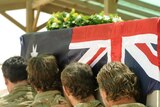 Soldiers from the Special Operations Task Group carry Sergeant Brett Wood's casket.