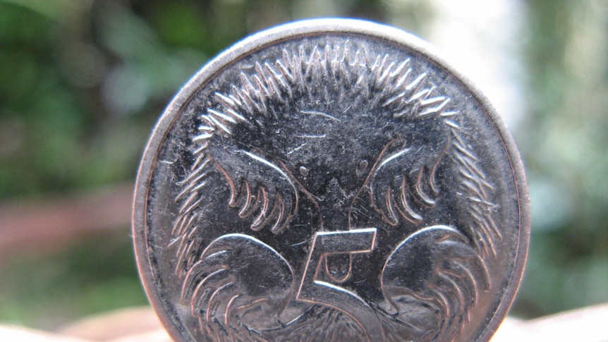 A five cent coin on its side.