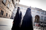 Women in niqabs at Christiansborg Palace in Copenhagen, Denmark.