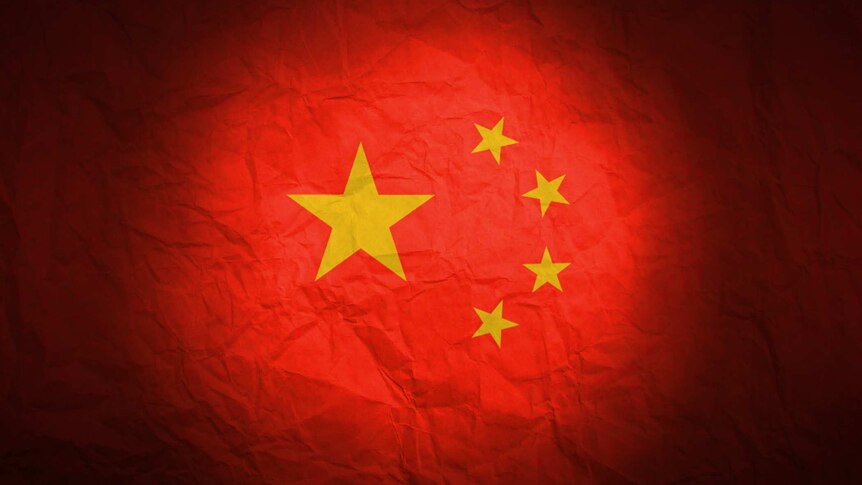 Graphic of China's Flag looking crumpled lit with a spotlight.