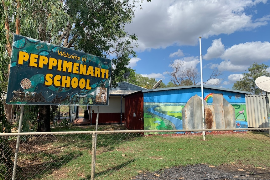 A sign and building of the Peppimenarti School. 