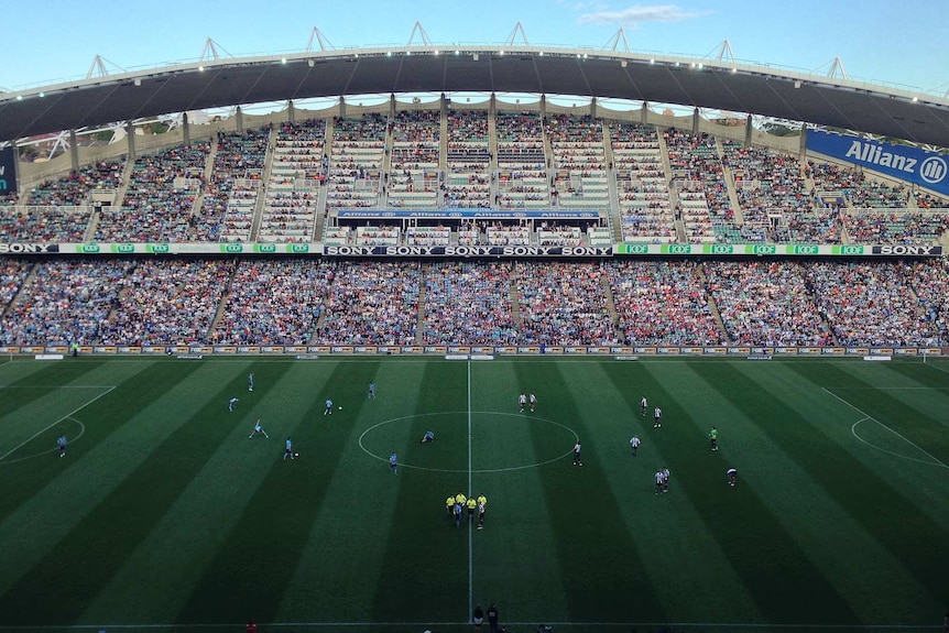 A wide shot of the stadium full of people