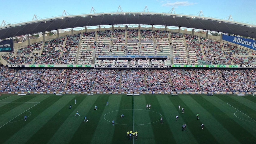 A wide shot of the stadium full of people