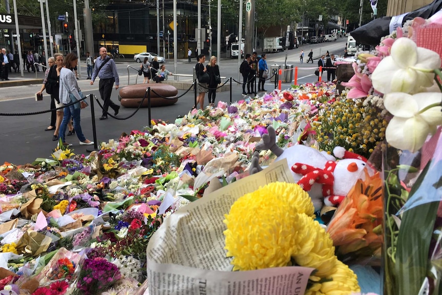 A flower memorial in Bourke St for the victims of a car attack in Melbourne.