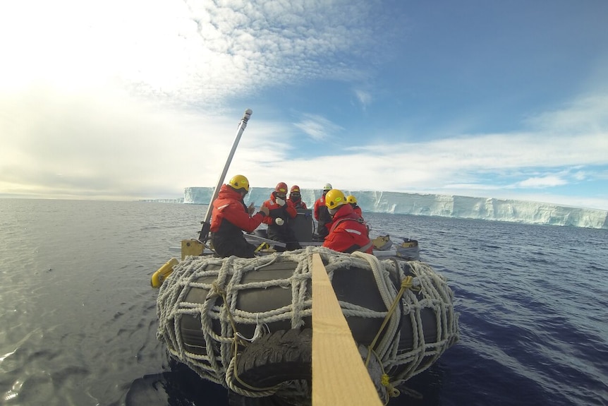 Antarctic researchers heading out to use sonar on a glacier to determine how it is melting