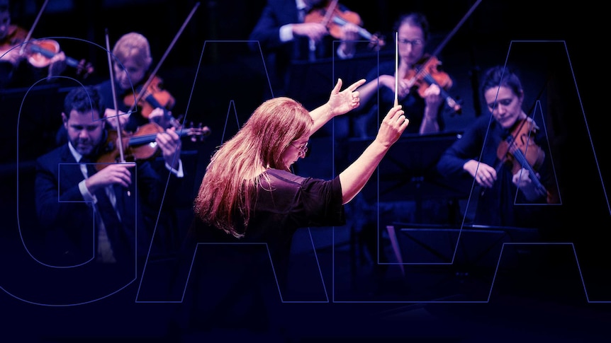 A close up of Chief Conductor Simone Young conducting the violins of the Sydney Symphony Orchestra