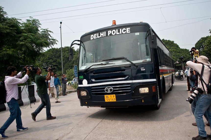 Indian police van believed to be carrying the accused in a gang rape case arrives at court in New Delhi