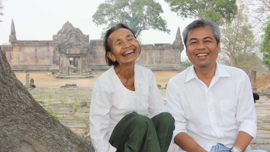 Youk Chhang with former Khmer Rouge tribunal defendant Im Chaem in 2011.