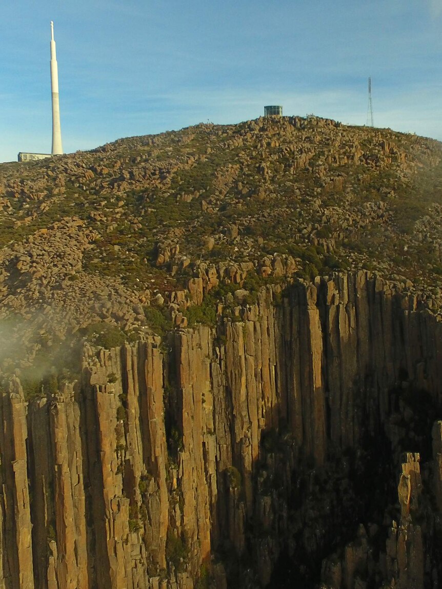 Drone camera view over the organ pipes to summit of kunanyi/Mt Wellington, Hobart, June 2018.