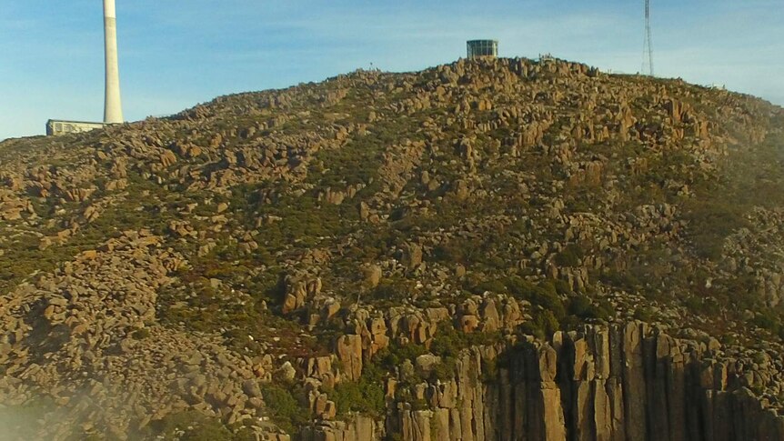 Drone camera view over the organ pipes to summit of kunanyi/Mt Wellington.