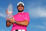 Jason Day with the Players Championship trophy