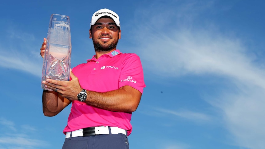 Jason Day with the Players Championship trophy