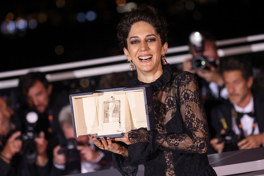 Zahra Amir Ebrahimi, winner of the award for best actress for 'Holy Spider' poses for photographers