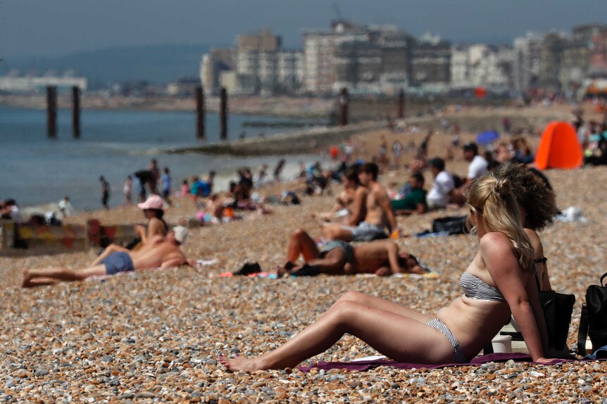 Brighton sunbathing after coronavirus measures eased